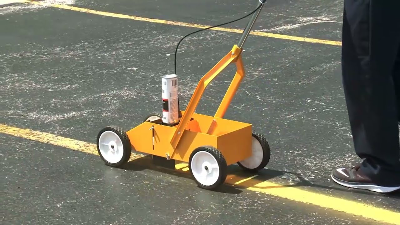 Line striping machine painting crisp white parking lot lines