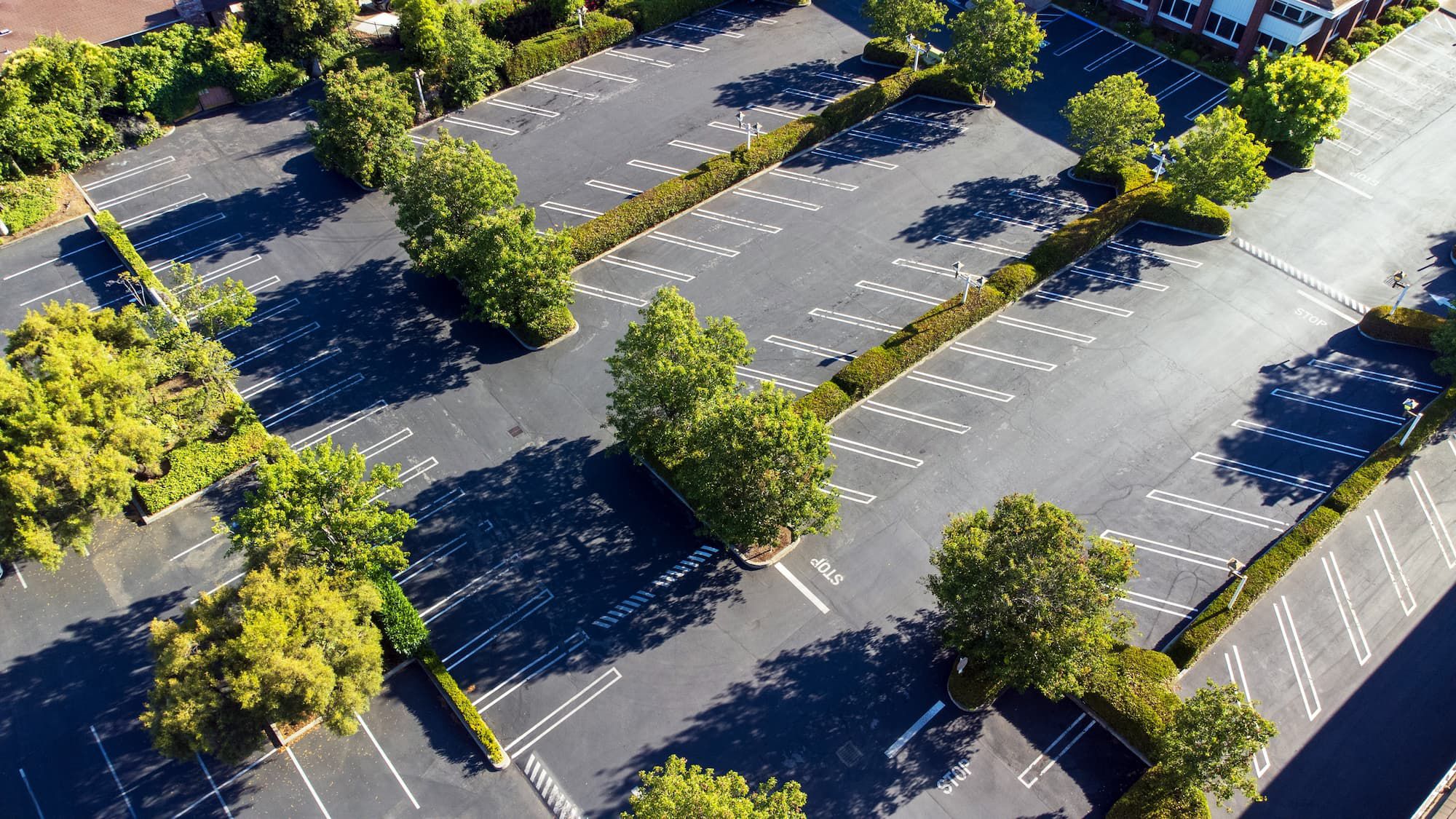 Large commercial parking lot with fresh striping
