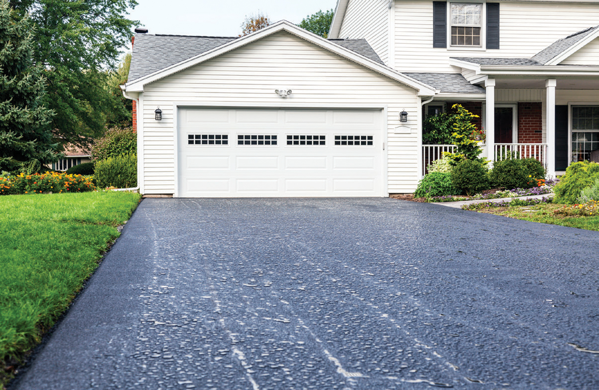 Residential asphalt driveway freshly sealed